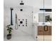 Luxurious shower featuring marble tile, black shower fixtures, and a glass enclosure at 1544 S Fillmore St, Denver, CO 80210