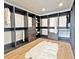 Spacious walk-in closet with custom dark cabinets and an oversized area rug at 1544 S Fillmore St, Denver, CO 80210
