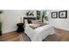 Inviting bedroom with plush bedding, modern decor, and a large window offering natural light at 2849 N Vine St, Denver, CO 80205