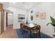 Elegant dining room with a wooden table, stylish chairs, and contemporary artwork at 2849 N Vine St, Denver, CO 80205