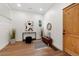Welcoming foyer with a wooden door, stylish decor, and a cozy bench at 2849 N Vine St, Denver, CO 80205