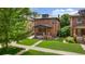 Charming two-story red brick home with a well-maintained front yard and inviting porch at 2849 N Vine St, Denver, CO 80205