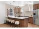 Stylish kitchen featuring a large island with seating, modern lighting, and high-end appliances at 2849 N Vine St, Denver, CO 80205