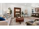 Cozy living room with an ornate fireplace, comfortable seating, and a view into the kitchen at 2849 N Vine St, Denver, CO 80205