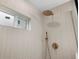 Contemporary shower featuring rainfall shower head, hand shower, tiled walls, and frosted window at 2849 N Vine St, Denver, CO 80205