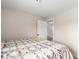 Cozy bedroom featuring a colorful patterned bedspread and neutral paint at 5865 E Ithaca Pl, Denver, CO 80237