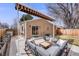 Backyard patio features comfortable seating under an awning, perfect for outdoor entertaining at 430 Osceola St, Denver, CO 80204