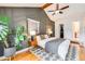 Cozy bedroom featuring a geometric accent wall, ceiling fan, and plush bedding with ample natural light and closet access at 430 Osceola St, Denver, CO 80204