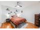 Cozy bedroom featuring natural light, hardwood floors, and stylish decor at 430 Osceola St, Denver, CO 80204