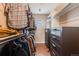 Well-organized walk-in closet with ample storage, custom shelving, drawers, and a unique arched window for natural light at 430 Osceola St, Denver, CO 80204
