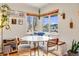 Bright dining area featuring a built-in bench and hardwood floors at 430 Osceola St, Denver, CO 80204