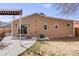 Exterior shot showing the backyard featuring a patio with seating, awning, and string lights at 430 Osceola St, Denver, CO 80204