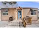 Charming home featuring a welcoming blue front door and a cozy porch area at 430 Osceola St, Denver, CO 80204