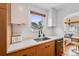 Bright kitchen featuring modern cabinets, stainless steel appliances, and a window above the sink at 430 Osceola St, Denver, CO 80204