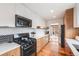 Contemporary kitchen boasting white countertops, stylish backsplash, and stainless steel appliances at 430 Osceola St, Denver, CO 80204