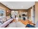 Spacious living room with hardwood floors, barn door, and home office setup at 430 Osceola St, Denver, CO 80204