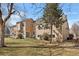 Spacious backyard with a lush green lawn and mature trees at 13040 W 63Rd Pl # C, Arvada, CO 80004