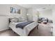 Bedroom includes neutral tones, cozy furnishings, and natural light streaming through the window at 13040 W 63Rd Pl # C, Arvada, CO 80004