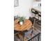 Bright dining area features a round wooden table with four stylish chairs at 13040 W 63Rd Pl # C, Arvada, CO 80004