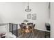 Elegant dining room with a round table, stylish chairs, and decorative artwork at 13040 W 63Rd Pl # C, Arvada, CO 80004