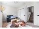 Cozy living room space with comfortable seating, stairs, and neutral decor at 13040 W 63Rd Pl # C, Arvada, CO 80004