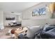 An inviting living room with a sitting area in an open room concept at 13040 W 63Rd Pl # C, Arvada, CO 80004