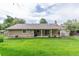 Backyard offers a covered porch, mature landscape, shed and room to enjoy outdoor activities at 7719 S Jackson Cir, Centennial, CO 80122