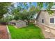 Beautiful backyard with green grass, storage shed, and a wooden fence for privacy and security at 7719 S Jackson Cir, Centennial, CO 80122