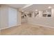 Spacious basement with recessed lighting and neutral walls offers potential for various uses at 7719 S Jackson Cir, Centennial, CO 80122