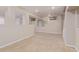 Open basement area with neutral carpet and paint has many design possibilities at 7719 S Jackson Cir, Centennial, CO 80122