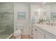 Bright bathroom featuring a marble countertop, glass-enclosed shower and tiled floor at 7719 S Jackson Cir, Centennial, CO 80122