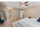Spacious bedroom featuring stylish decor, a ceiling fan, and beautiful hard wood floors at 7719 S Jackson Cir, Centennial, CO 80122