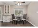 Bright dining area with a small table, two chairs, and built-in cabinet storage at 7719 S Jackson Cir, Centennial, CO 80122
