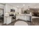 Bright kitchen featuring stainless appliances, white cabinets, and granite countertops at 7719 S Jackson Cir, Centennial, CO 80122
