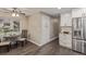 Eat-in kitchen area with stainless refrigerator, built-in cabinets and space for a dining table at 7719 S Jackson Cir, Centennial, CO 80122