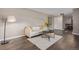 Bright living room with neutral tones, modern furnishings, and sleek flooring at 7719 S Jackson Cir, Centennial, CO 80122