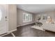 Open-concept living room with natural light, contemporary furnishings, and hardwood floors at 7719 S Jackson Cir, Centennial, CO 80122