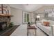 This living room has wood floors, a fireplace, and a white sofa at 7719 S Jackson Cir, Centennial, CO 80122