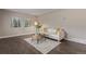Inviting living room with stylish decor, modern lighting, and beautiful flooring at 7719 S Jackson Cir, Centennial, CO 80122