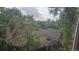 Backyard view from window surrounded by lots of trees and green space at 18531 E Tanforan Pl, Aurora, CO 80015