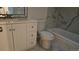 Updated bathroom features modern vanity, new toilet, and shower with decorative marble-look tile surround at 18531 E Tanforan Pl, Aurora, CO 80015