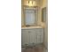 Bathroom boasts double vanity and framed mirror with modern lighting at 18531 E Tanforan Pl, Aurora, CO 80015