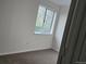 Empty bedroom featuring neutral carpet and a bright sunny window at 18531 E Tanforan Pl, Aurora, CO 80015