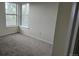 Cozy bedroom featuring neutral carpet and a bright double window at 18531 E Tanforan Pl, Aurora, CO 80015