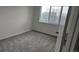 Bright bedroom featuring neutral carpet and a sunny window at 18531 E Tanforan Pl, Aurora, CO 80015