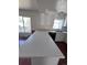 Bright kitchen with stainless steel appliances, white cabinets, and a breakfast bar at 18531 E Tanforan Pl, Aurora, CO 80015