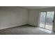 Inviting living room with soft carpet and sliding glass doors to the backyard at 18531 E Tanforan Pl, Aurora, CO 80015