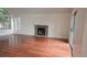 Spacious living room with hardwood floors and stone fireplace at 18531 E Tanforan Pl, Aurora, CO 80015