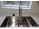 Updated kitchen sink with goose-neck faucet under window at 18531 E Tanforan Pl, Aurora, CO 80015