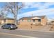 Brick home with a cozy front porch, offering curb appeal and a welcoming entry at 11624 Claude Ct, Northglenn, CO 80233